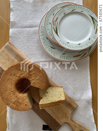 Chiffon cake and plate on the table Chiffon cake and plate on the table 87585671