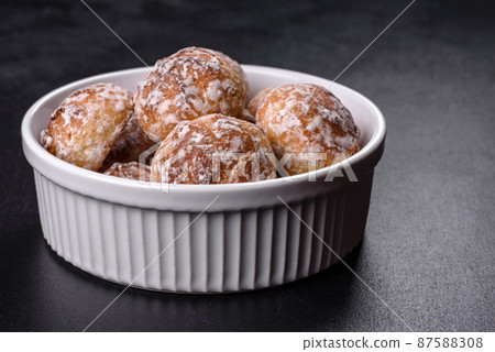 Tasty homemade gingerbread cookies on dark concrete table 87588308
