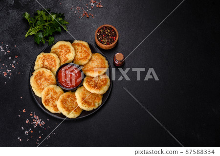 Potato Cakes. Vegetable fritters, latkes, hash browns. Vegetable pancakes 87588334