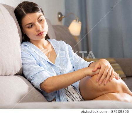 Woman is thoughtful and bored alone at home Woman is thoughtful and bored alone at home 87589896