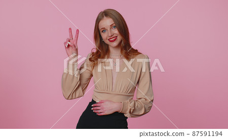 Businesswoman girl showing victory sign, hoping for success and win, doing peace gesture, smiling Businesswoman girl showing victory sign, hoping for success and win, doing peace gesture, smiling 87591194