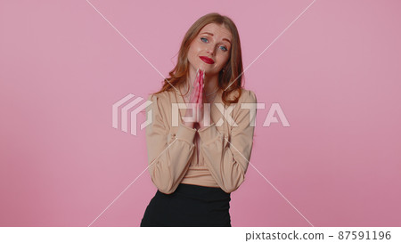 Businesswoman praying, looking upward and making wish, asking with hopeful imploring expression Businesswoman praying, looking upward and making wish, asking with hopeful imploring expression 87591196