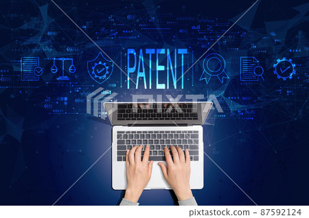 Patent concept with person using laptop Patent concept with person using laptop 87592124