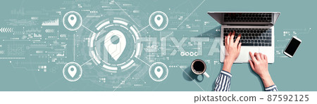 Map pin concept with person using laptop Map pin concept with person using laptop 87592125