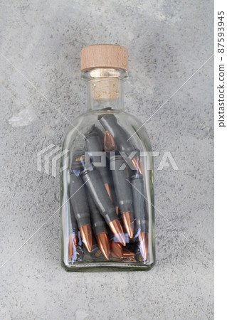 kalashnikov 7,62 mm bullets in a spice jar 87593945