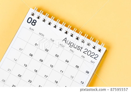 August 2022 desk calendar on light yellow background. August 2022 desk calendar on light yellow background. 87595557