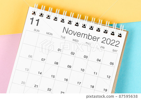 November 2022 desk calendar on multicolored background. 87595638