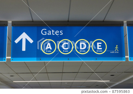 International Airport sign Gates A C D E in interior air terminal International Airport sign Gates A C D E in interior air terminal 87595863
