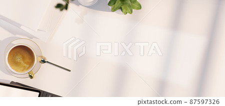 Workspace tabletop with a cup of coffee, office accessories and copy space Workspace tabletop with a cup of coffee, office accessories and copy space 87597326