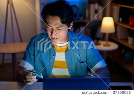 man online shopping with card man online shopping with card 87598058