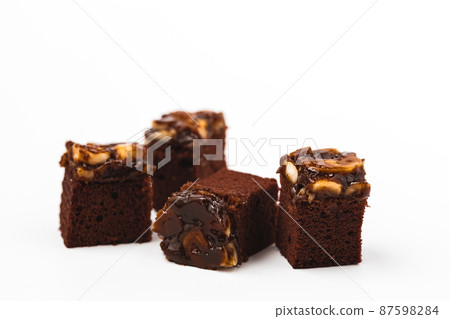 Delicious toffee cake on white background 87598284