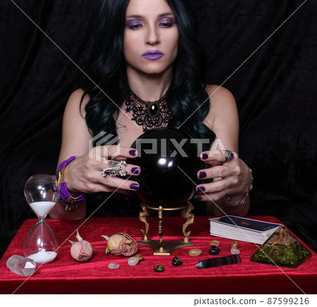 Psychic with crystal ball and tarot cards, Shallow DOF Psychic with crystal ball and tarot cards, Shallow DOF 87599216