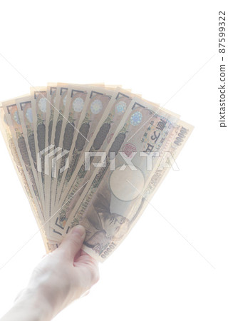 Hand holding 100,000 yen Hand holding 100,000 yen 87599322
