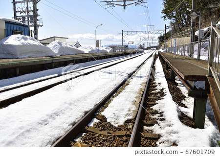 Photographing the scenery of Kamaya Station on the South Hokkaido Railway Company in Kikonai Town, Hokkaido in early spring 87601709