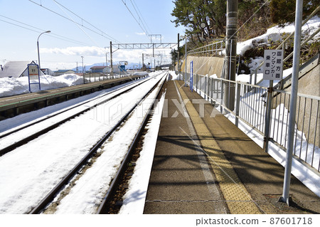 Photographing the scenery of Kamaya Station on the South Hokkaido Railway Company in Kikonai Town, Hokkaido in early spring 87601718
