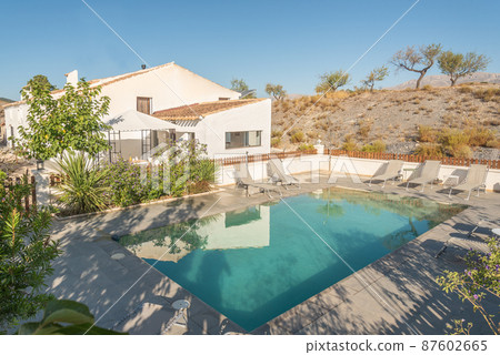 A rural hotel with swimming pool on a hill 87602665