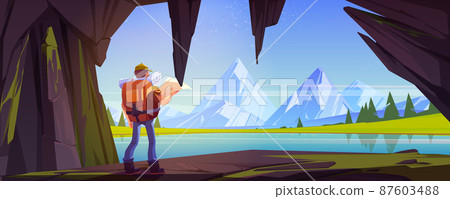 Hiker man in cave with view to lake and mountains 87603488