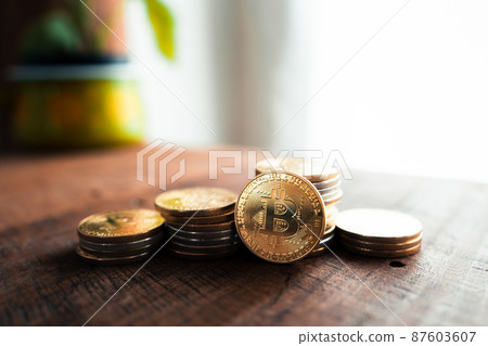 Crypto coins and graphs in the computer screen Crypto coins and graphs in the computer screen 87603607