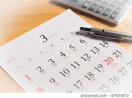 March calendar Year-end March calendar, calculator and ballpoint pen 87603672