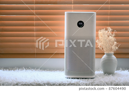 Air purifier in living room for filter and cleaning removing dust PM2.5 in home. 87604490