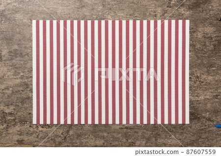 Top view of red tablecloth for food on cement background. Empty space for your design 87607559