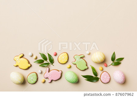 holiday preparation Multi colors Easter eggs with cookies on colored background . Pastel color Easter eggs. holiday concept with copy space holiday preparation Multi colors Easter eggs with cookies on colored background . Pastel color Easter eggs. holiday concept with copy space 87607962