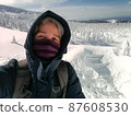 Young Man Smile Camera Taking Selfie Photo on top viewpoint mountain Zao, Yamagata. with snow monster background. 87608530