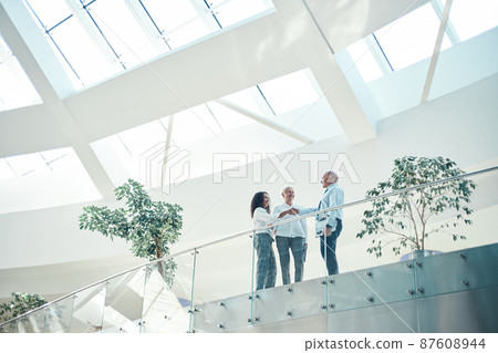 business people shaking hands standing on the balcony in the business center. 87608944