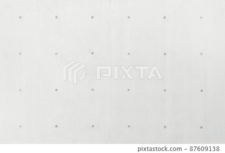 帶分離孔的白灰色混凝土牆表面的背景圖像 87609138