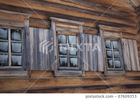 Traditional wooden house windows of Russia Siberia Shutters glass. Frozen glass. Traditional wooden house windows of Russia Siberia Shutters glass. Frozen glass. 87609353