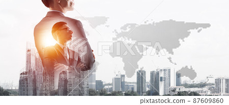 Concept of business success and control with confident boss against cityscape background 87609860