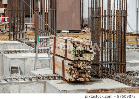 Reinforcement work at a construction site: Delivery of buta corners Reinforcement work at a construction site: Delivery of buta corners 87609872