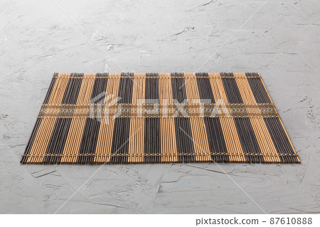 Perspective view of brown tablecloth for food on cement background. Empty space for your design 87610888