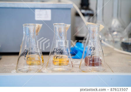 Equipment for the analysis of flasks with chemical elements, light background Equipment for the analysis of flasks with chemical elements, light background 87613507
