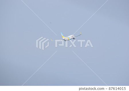 An airplane flying in the sky An airplane flying in the sky 87614015