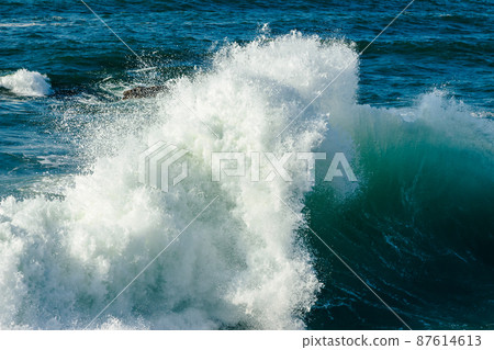 Wave breaking in the sea. Wave breaking in the sea. 87614613