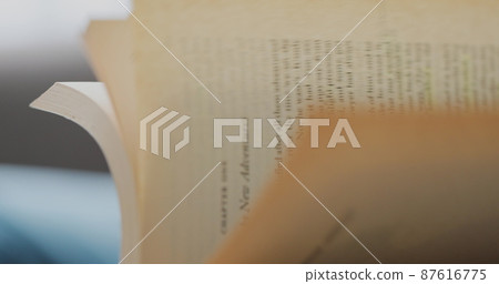 Woman hands close-up quickly flip through all the pages of the book. Woman hands close-up quickly flip through all the pages of the book. 87616775