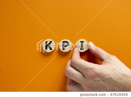 KPI, key performance indicator symbol. Concept word KPI, key performance indicator on wooden circles on beautiful orange background, copy space. Business, KPI, key performance indicator concept. KPI, key performance indicator symbol. Concept word KPI, key performance indicator on wooden circles on beautiful orange background, copy space. Business, KPI, key performance indicator concept. 87616926