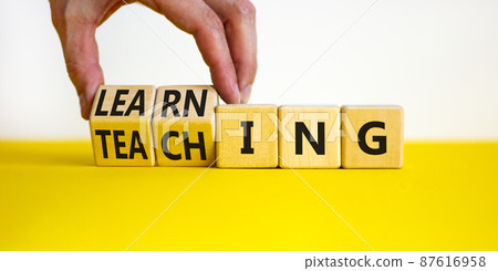 Learning or teaching symbol. Businessman turns wooden cubes and changes the word Teaching to Learning. Beautiful yellow table white background. Educational learning or teaching concept. Copy space. Learning or teaching symbol. Businessman turns wooden cubes and changes the word Teaching to Learning. Beautiful yellow table white background. Educational learning or teaching concept. Copy space. 87616958