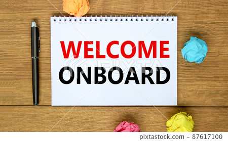 Welcome onboard and support symbol. Concept words Welcome onboard on white note. Metallic pen. Beautiful wooden background. Copy space. Business and Welcome onboard concept. 87617100
