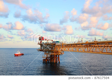 Offshore construction platform for production oil and gas. Oil and gas industry and hard work. Production platform and operation process by manual and auto function from control room. Offshore construction platform for production oil and gas. Oil and gas industry and hard work. Production platform and operation process by manual and auto function from control room. 87617504