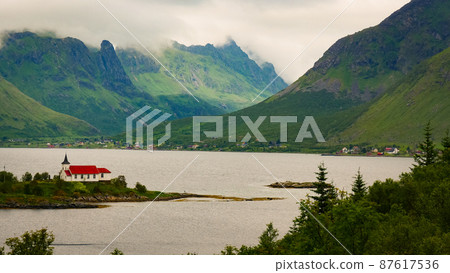Fjord landscape with church. Lofoten Norway 87617536