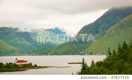 Fjord landscape with church. Lofoten Norway Fjord landscape with church. Lofoten Norway 87617539