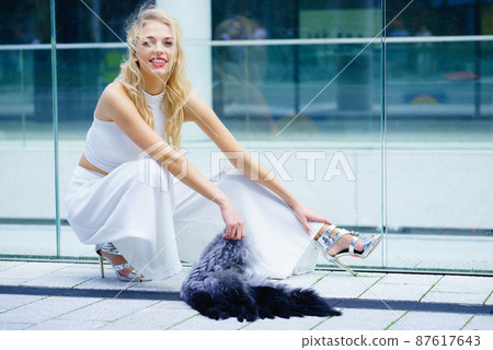 Woman wearing crop top and culottes Woman wearing crop top and culottes 87617643