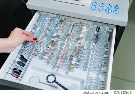 box with a set of test spectacle lenses for the examination. ophthalmologist 87618568