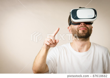 Adult man wearing vr goggles 87618682