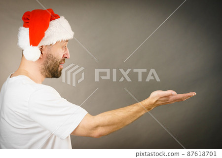 Christmas man with open hand copy space Christmas man with open hand copy space 87618701