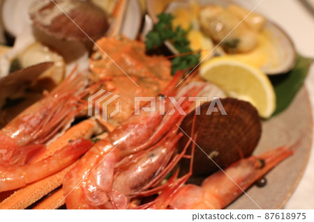 A plate filled with fresh seafood 87618975