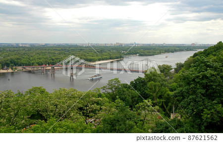 Kyiv or Kiev, Ukraine: Dnieper River and Park Bridge seen from Vladimiro kalva or Saint Volodymyr Hill near to Volodymyr the Great Monument. 87621562