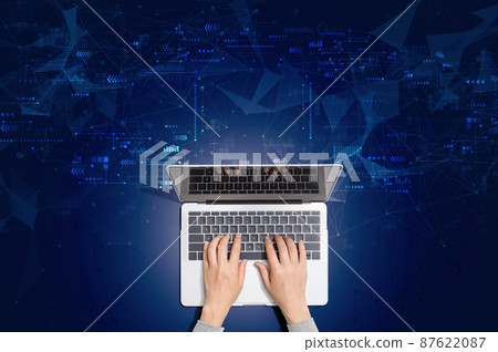 Technology screen with person using laptop 87622087